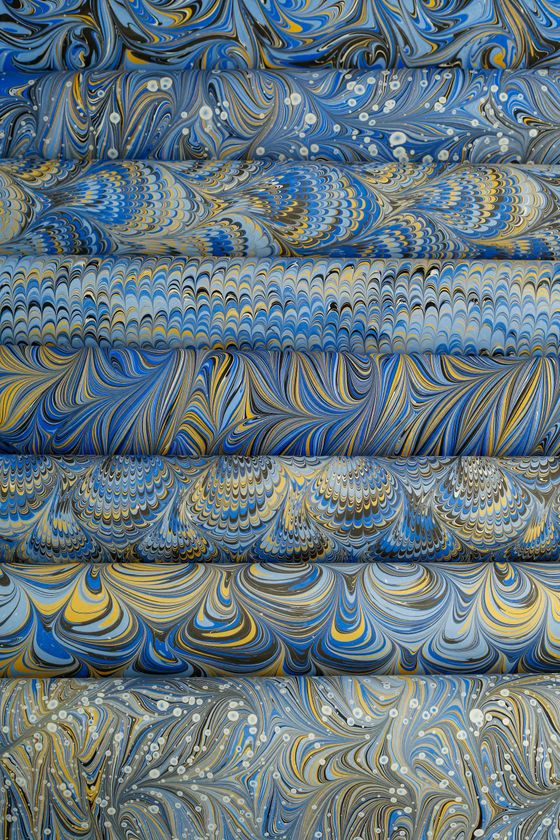 Marbled endpaper in indigo and gold — photo by betul nur akyurek on Pexels