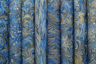 An array of marbled patterned papers — photo by betül nur akyürek on Pexels