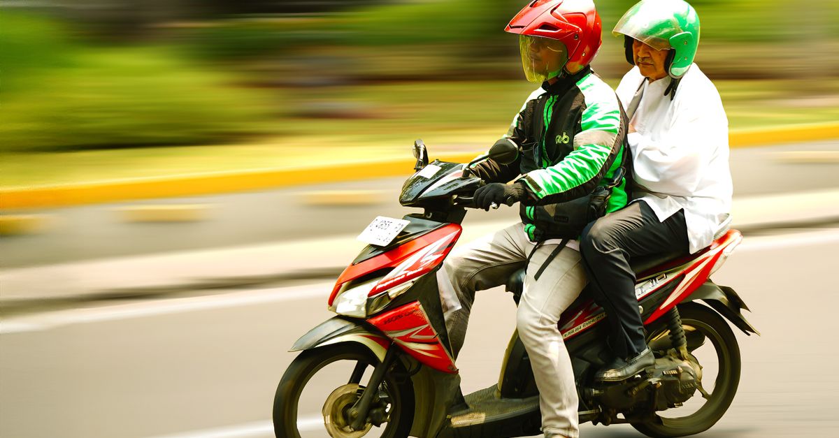 2 People Ride Motorcycle Two People Riding a Motorcycle on City Street · Free Stock Photo