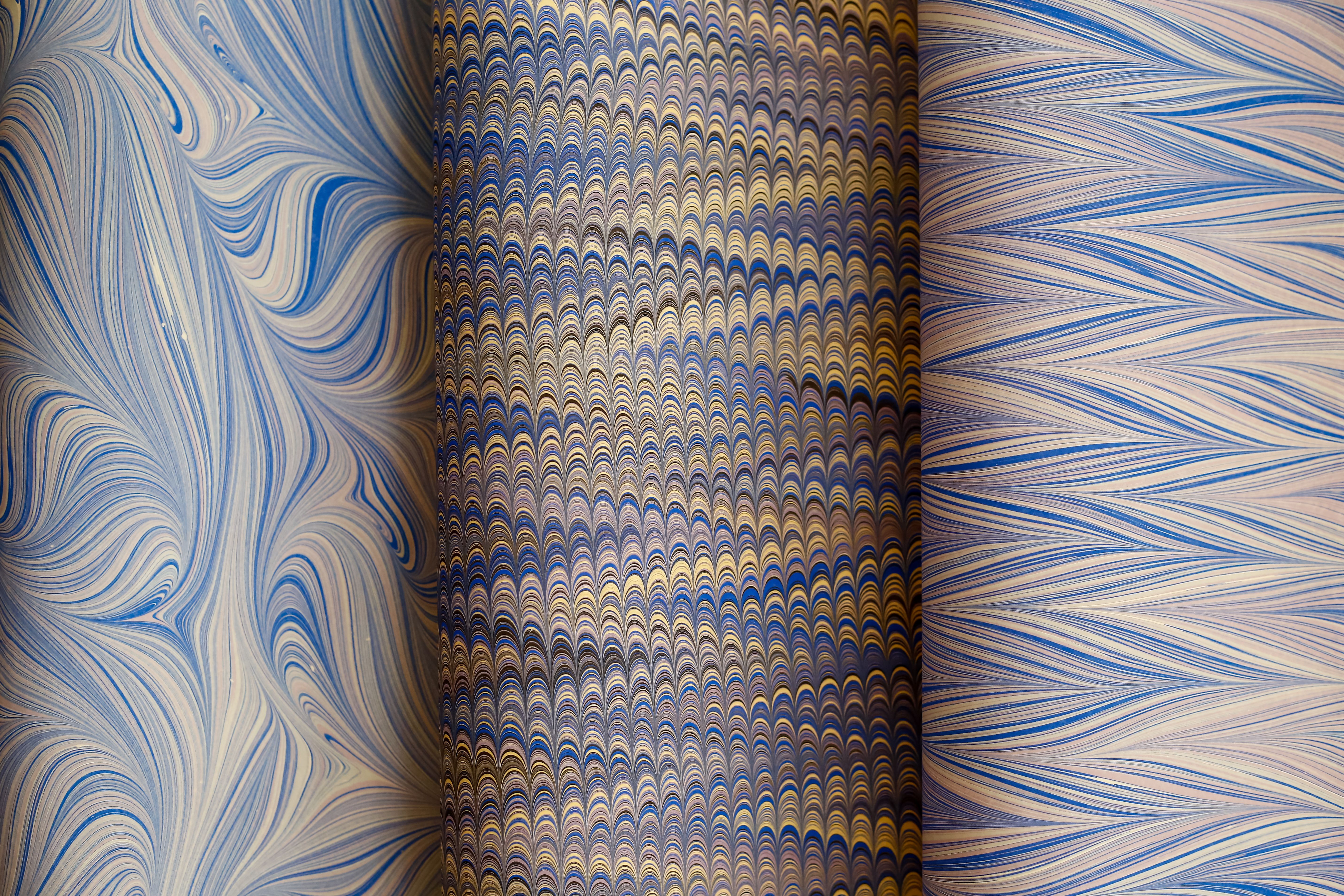 Vibrant Marbled Paper Patterns in Blue and Gold · Free Stock Photo