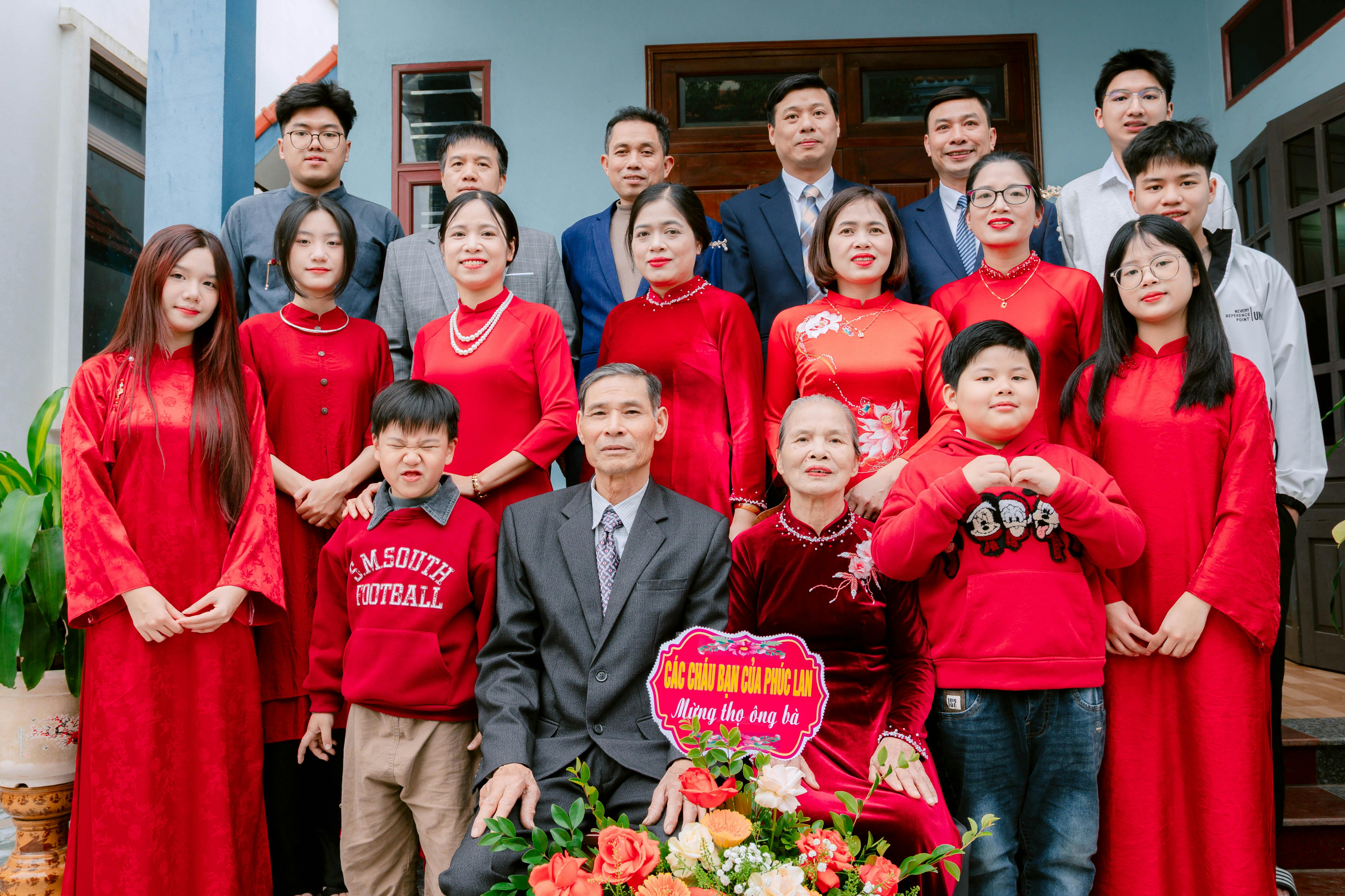 Family Gathering in Red Attire for Celebration