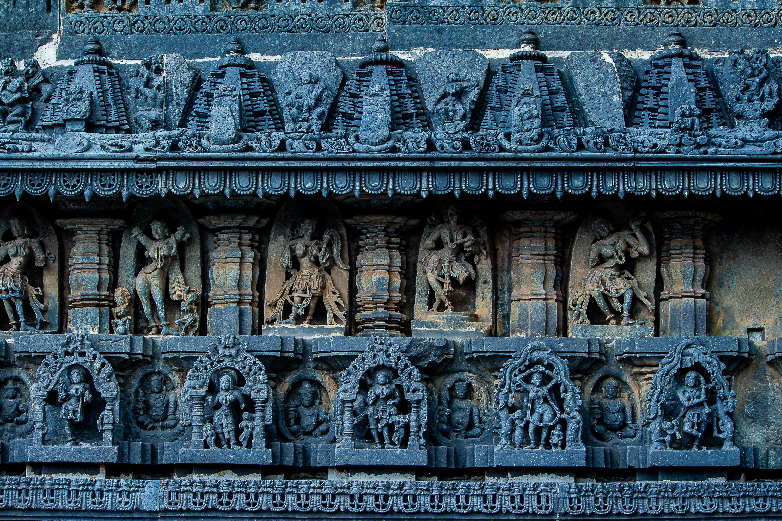 Intricate Stone Carvings on Ancient Temple Wall · Free Stock Photo