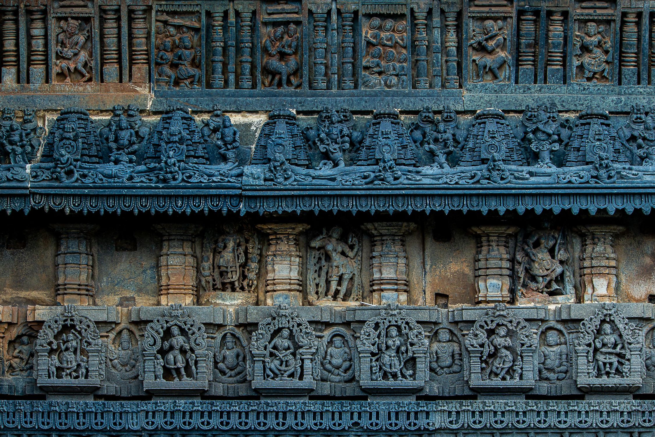 Intricate Stone Carvings on Ancient Temple Wall · Free Stock Photo