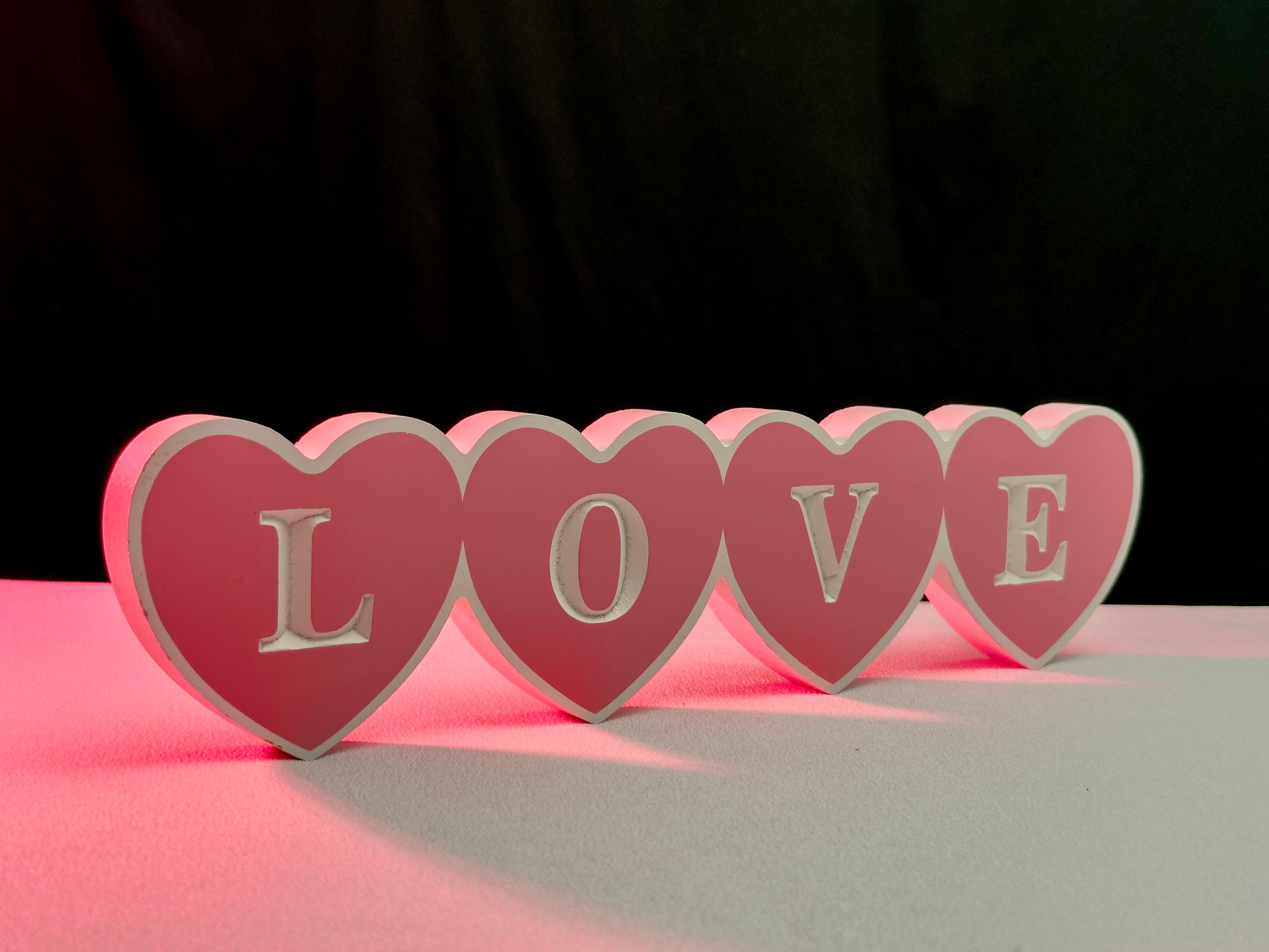 Pink Heart Shaped 'Love' Sign with Red Glow · Free Stock Photo