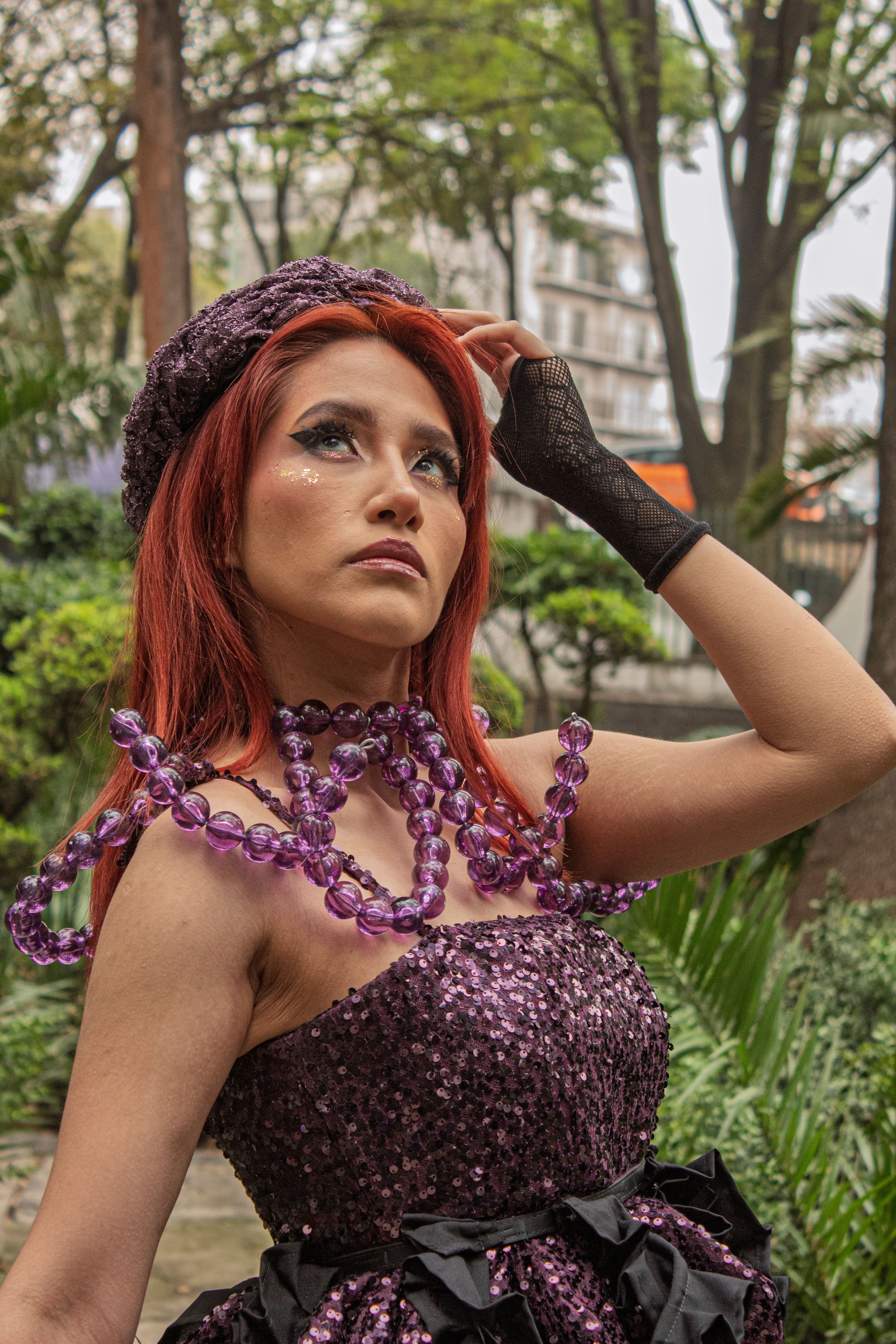 A conceptual fantasy portrait of a woman in colorful fashion outdoors in Mexico City.