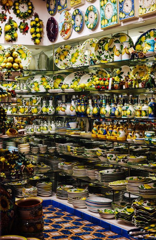 Free Colorful display of artisan ceramic plates and bowls with lemon designs in a traditional shop. Stock Photo