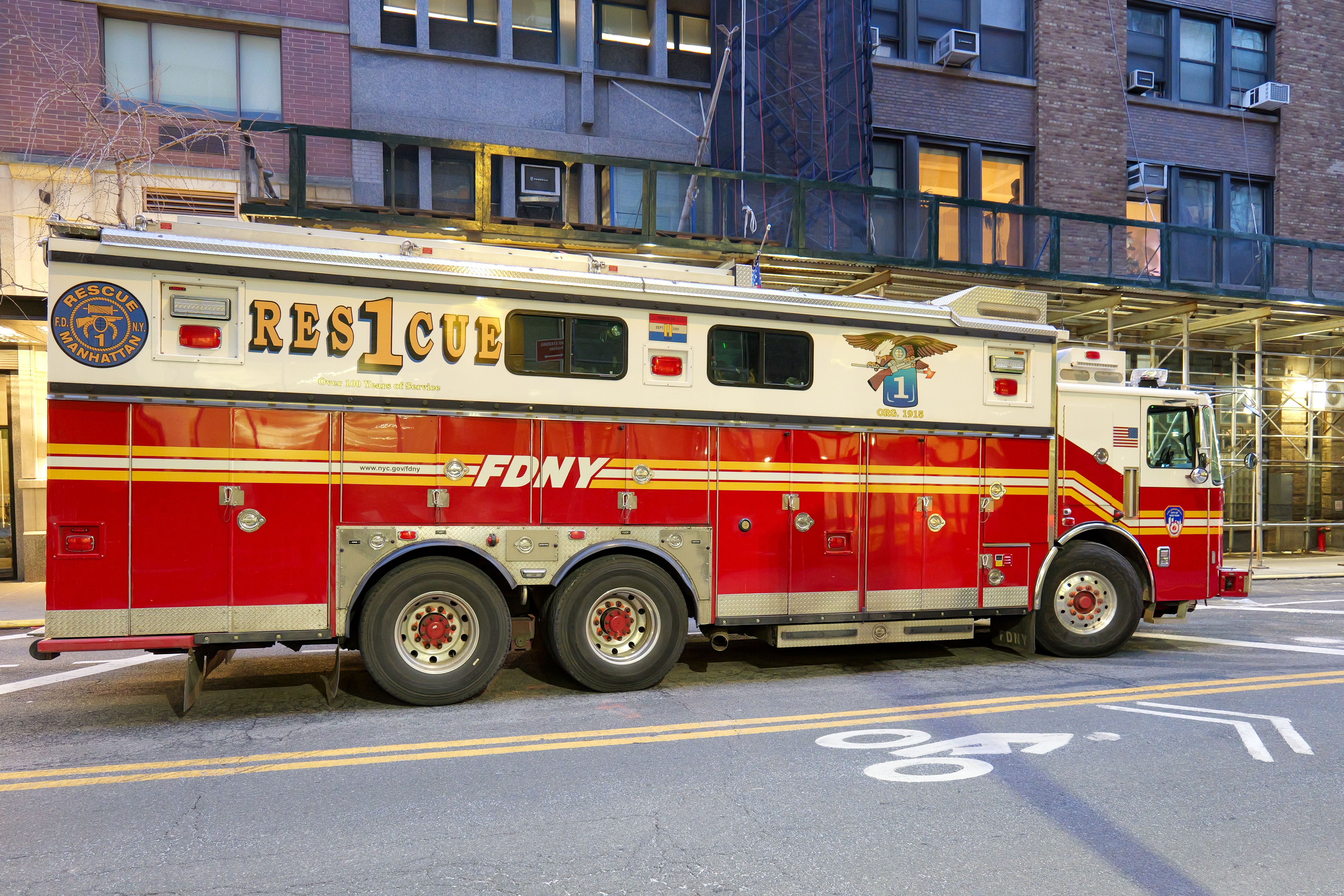 FDNY Rescue 1 truck parked in Manhattan, New York City street.
