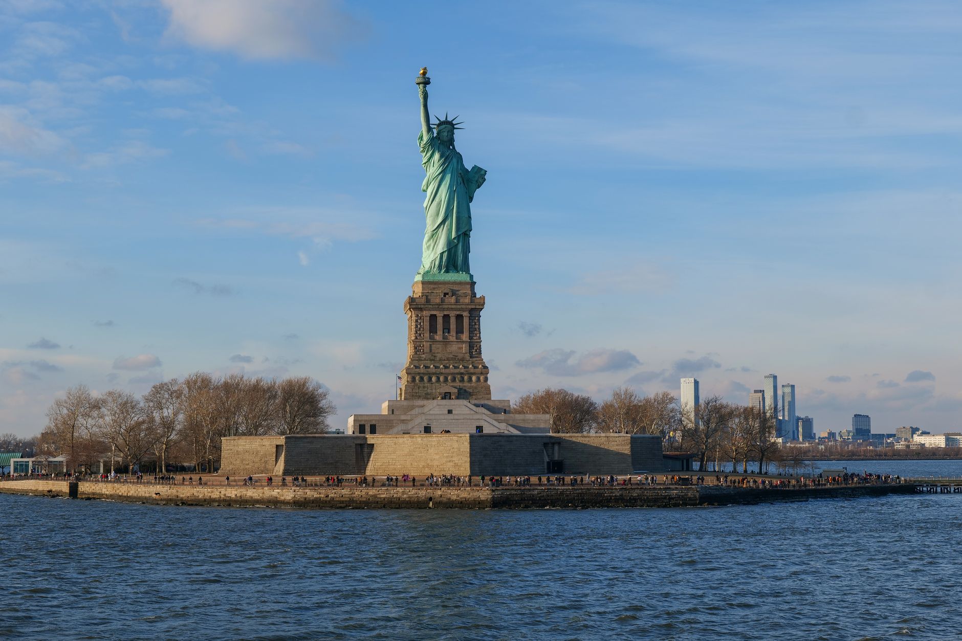 Capture of the Statue of Liberty with the New York City skyline in the background.