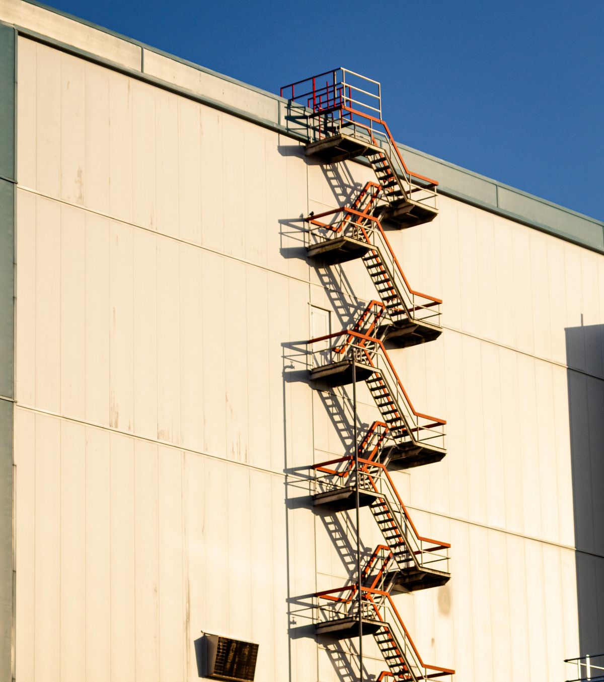 Fire Escape Stairs on a Residential Building Facade · Free Stock Photo