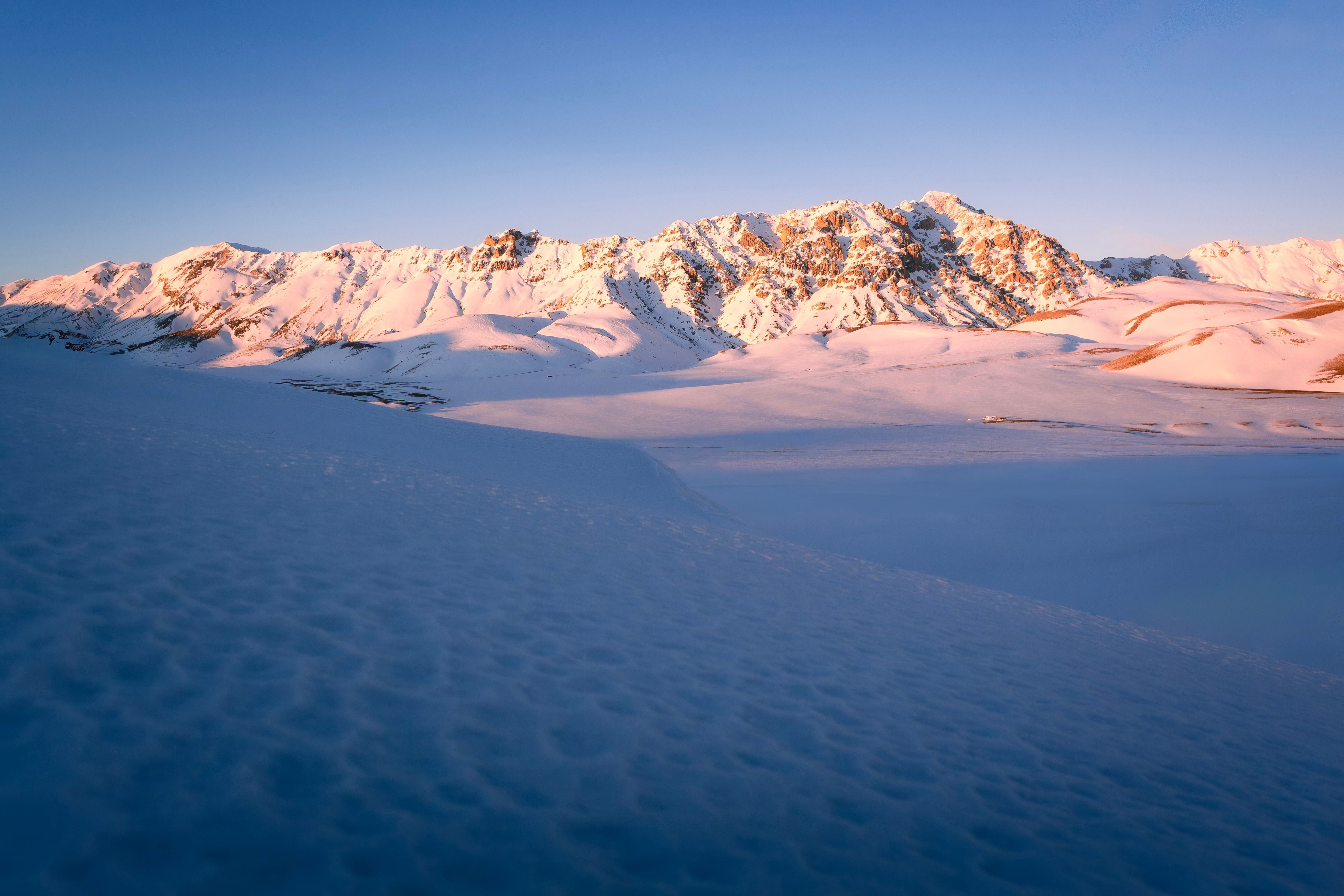 Snow-Covered Mountains at Sunrise in Abruzzo · Free Stock Photo
