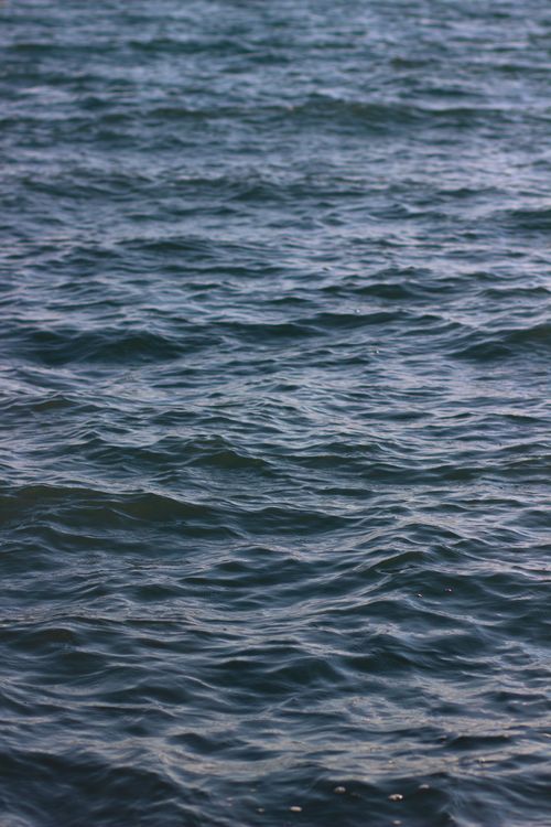 Free Serene view of rippling blue waves on Issyk-Kul Lake in Kyrgyzstan, capturing the essence of calm and nature. Stock Photo