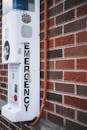 Emergency Call Box Against Brick Wall
