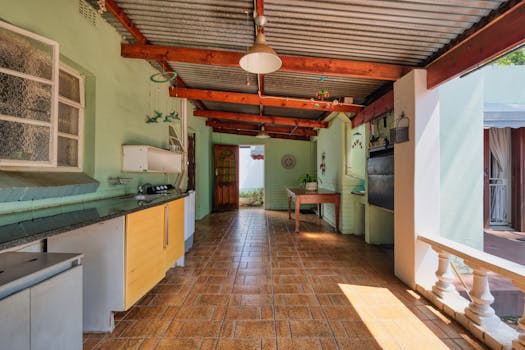 Explore this inviting outdoor kitchen blending modern design with rustic charm.