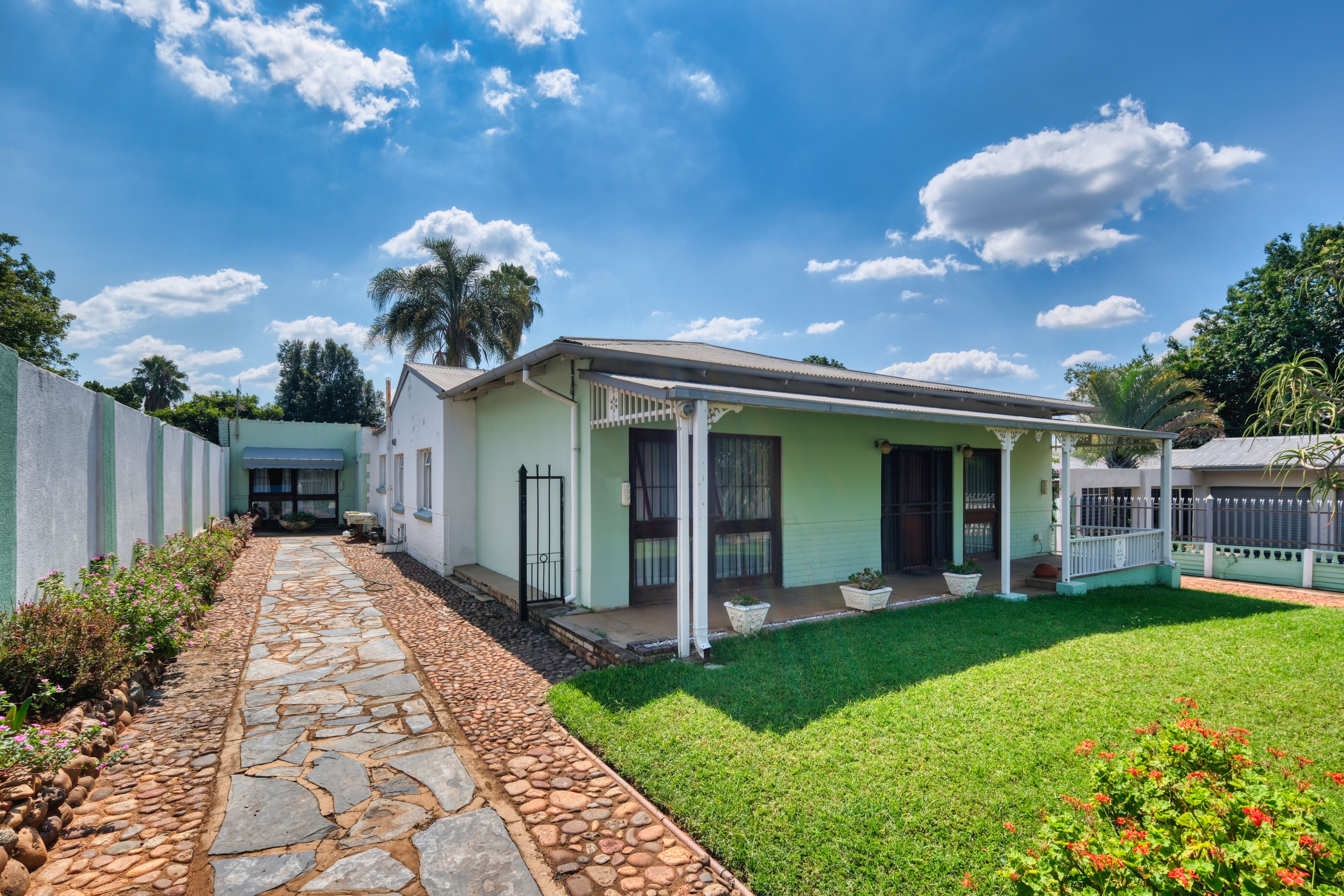 A welcoming residential home with a landscaped garden