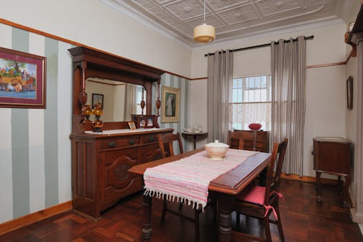 Charming dining room with vintage decor and antique furniture, perfect for a cozy meal.