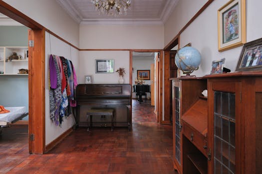 Elegant hallway with vintage piano and decor, showcasing classic home style.