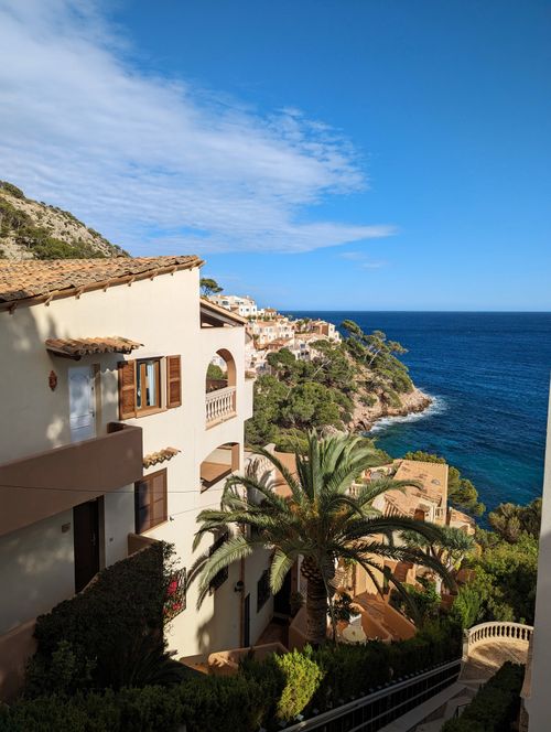Free Scenic Mediterranean architecture overlooking the blue ocean on a sunny day. Stock Photo
