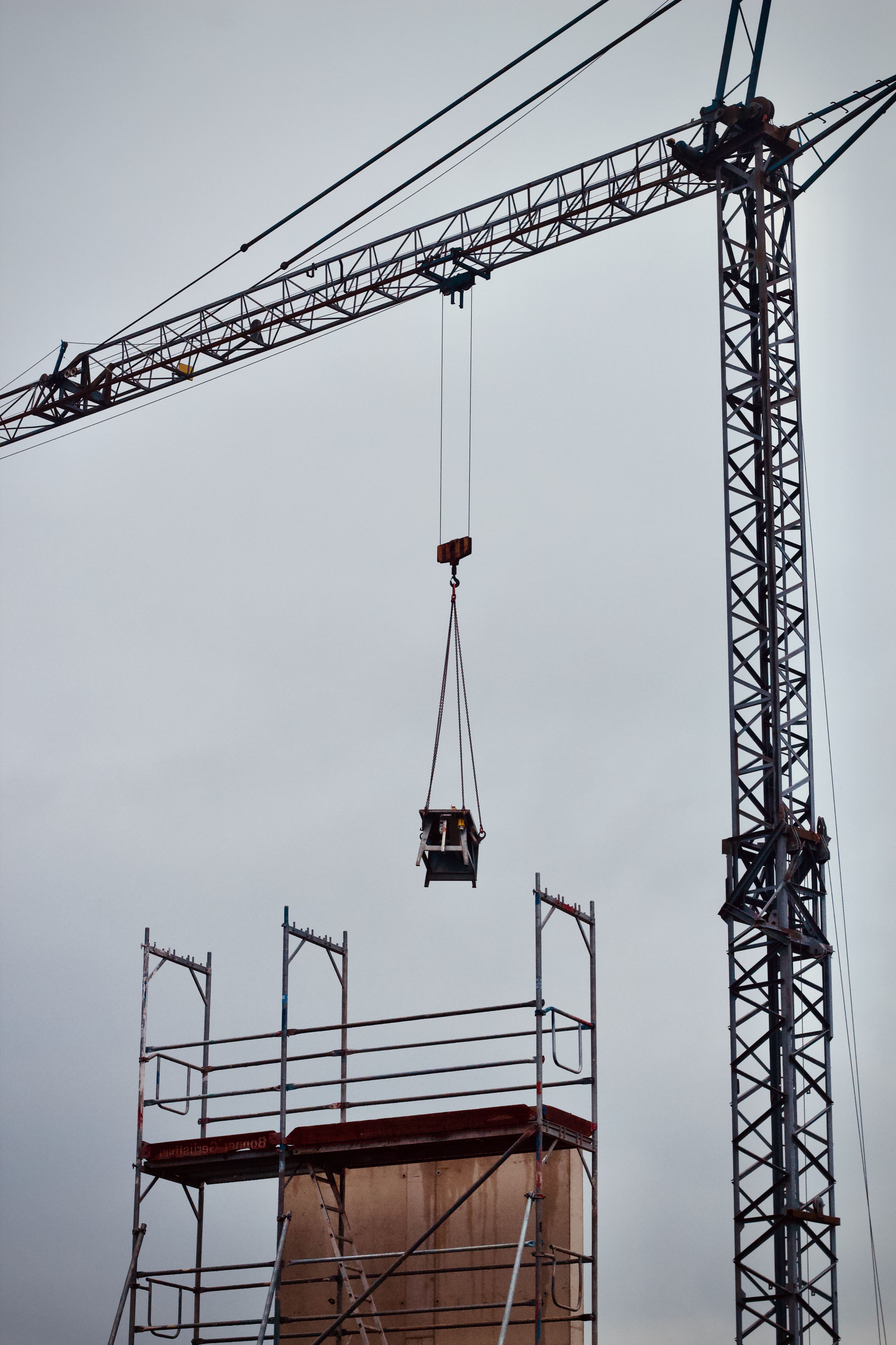 Industrial Construction Site with Tower Crane · Free Stock Photo