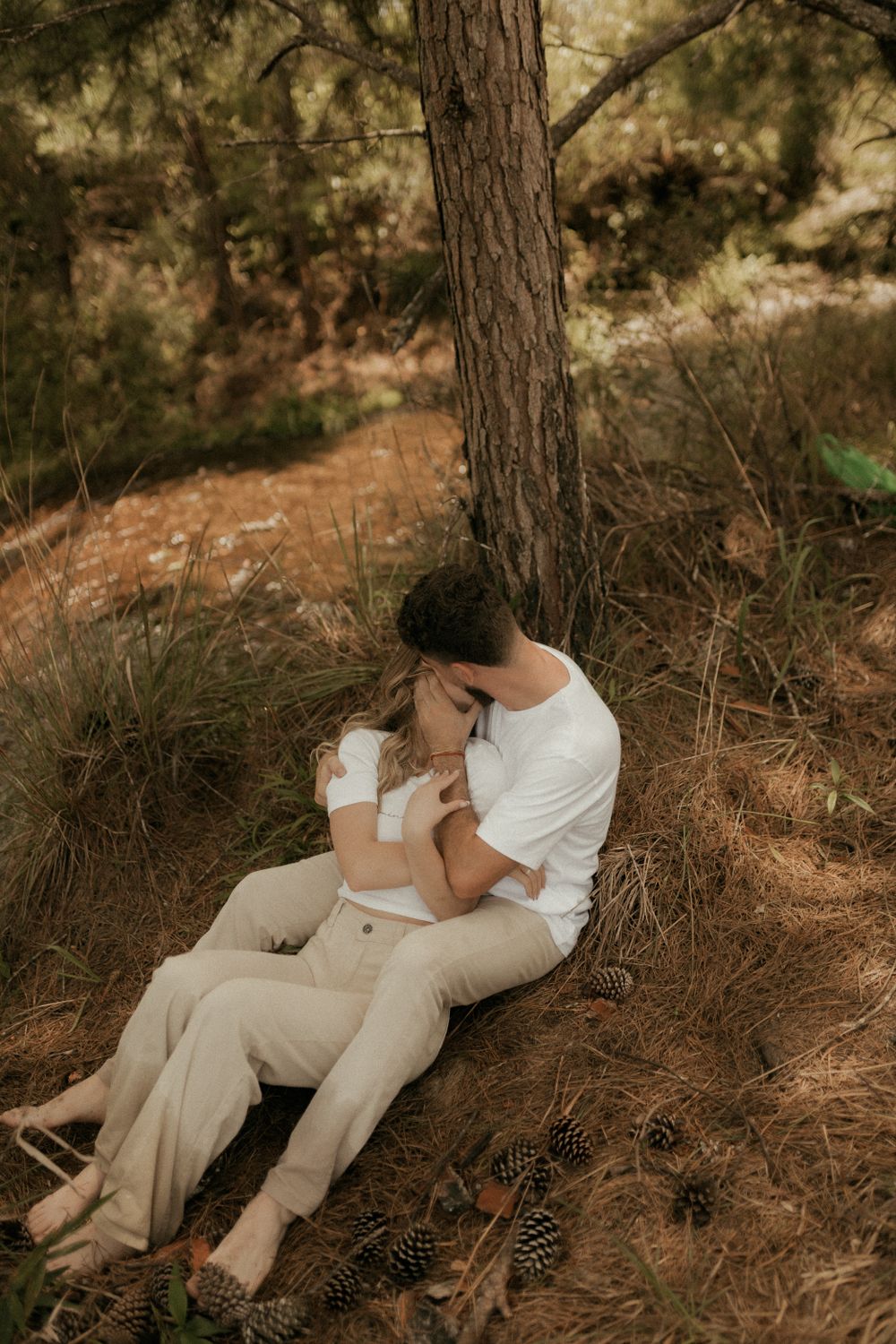 Romantic Couple Hugging Outdoors in Forest · Free Stock Photo