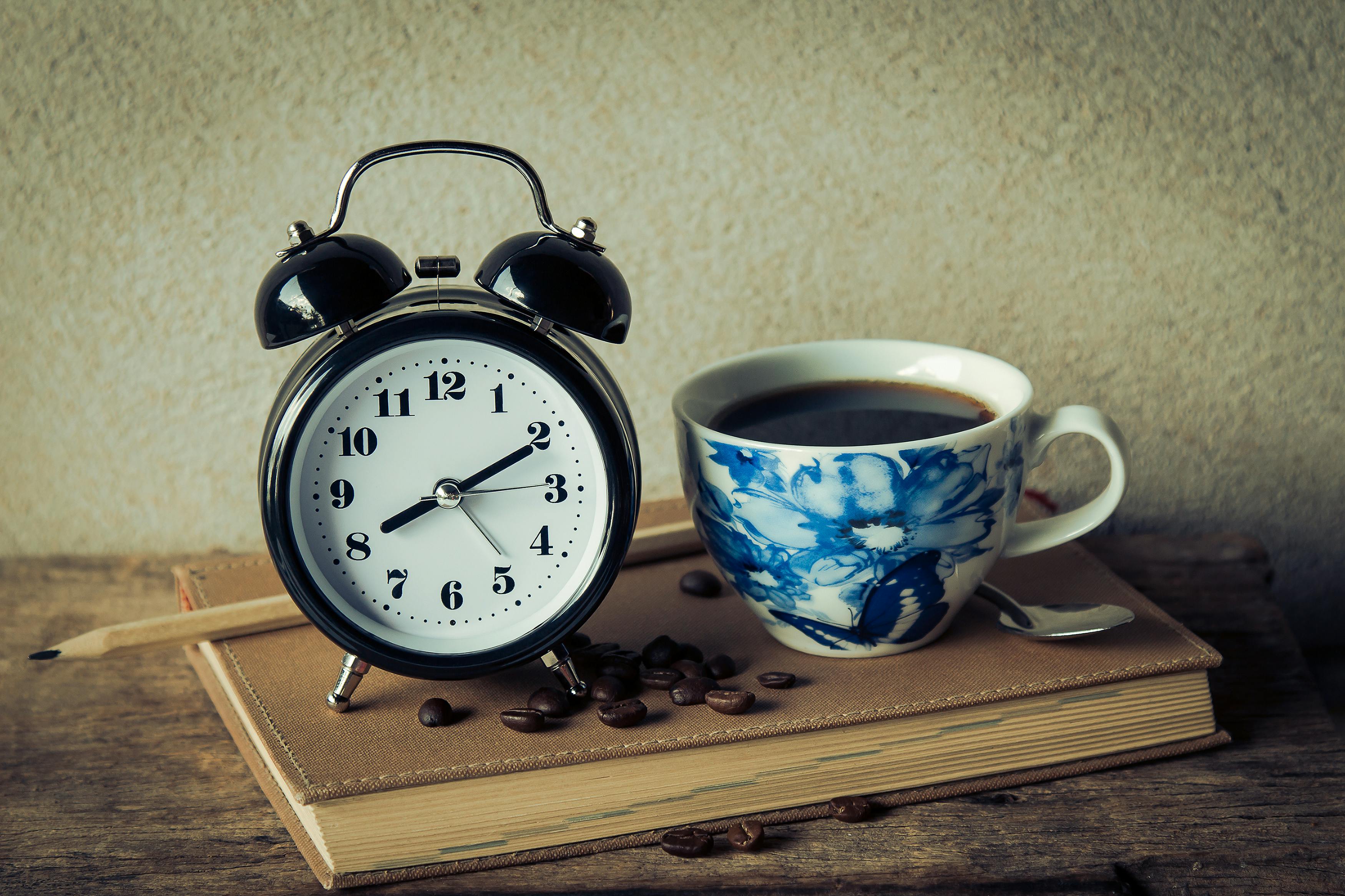 round black analog table alarm clock