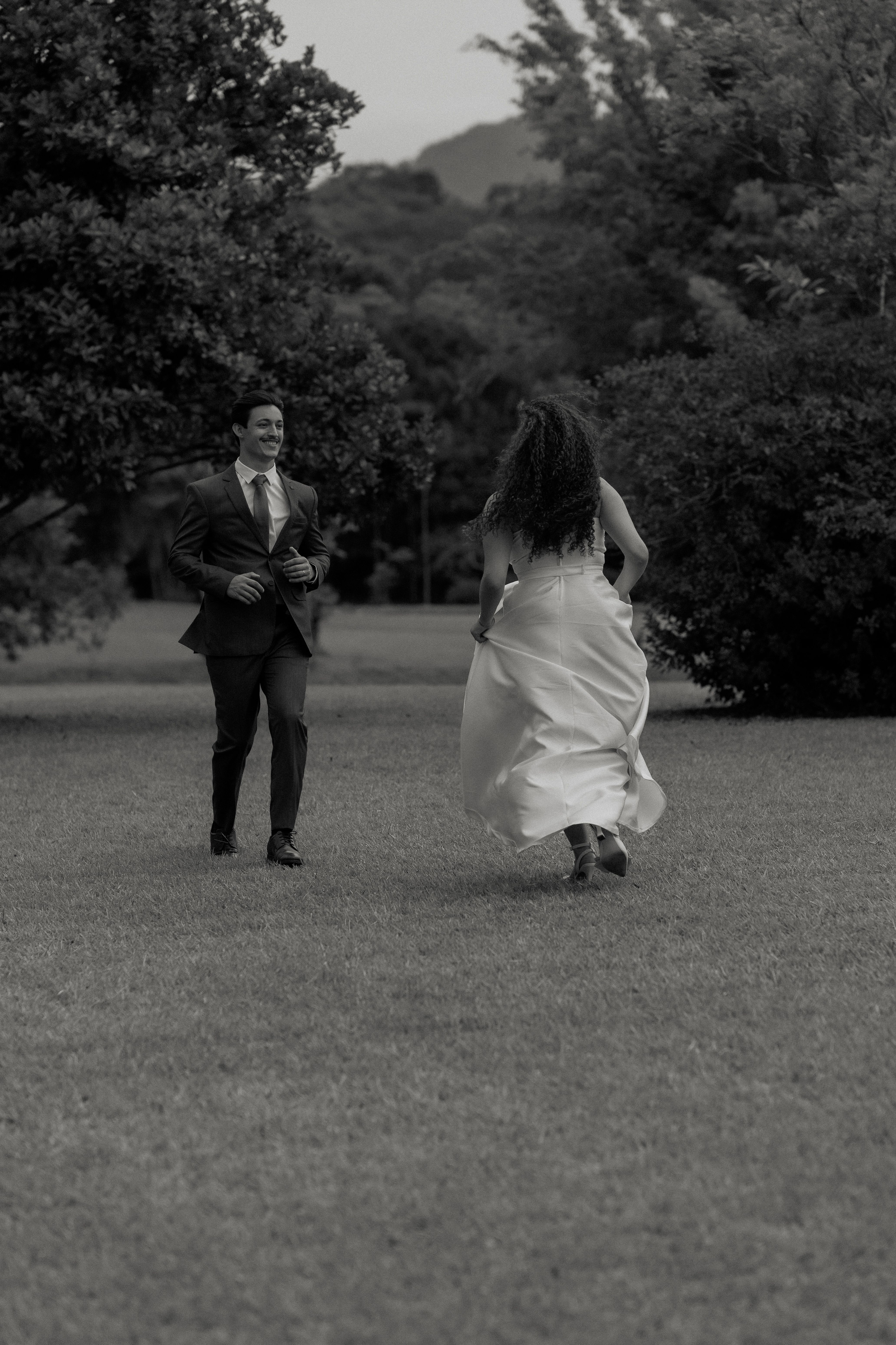 Romantic Couple Running Through Park in Black and White · Free Stock Photo