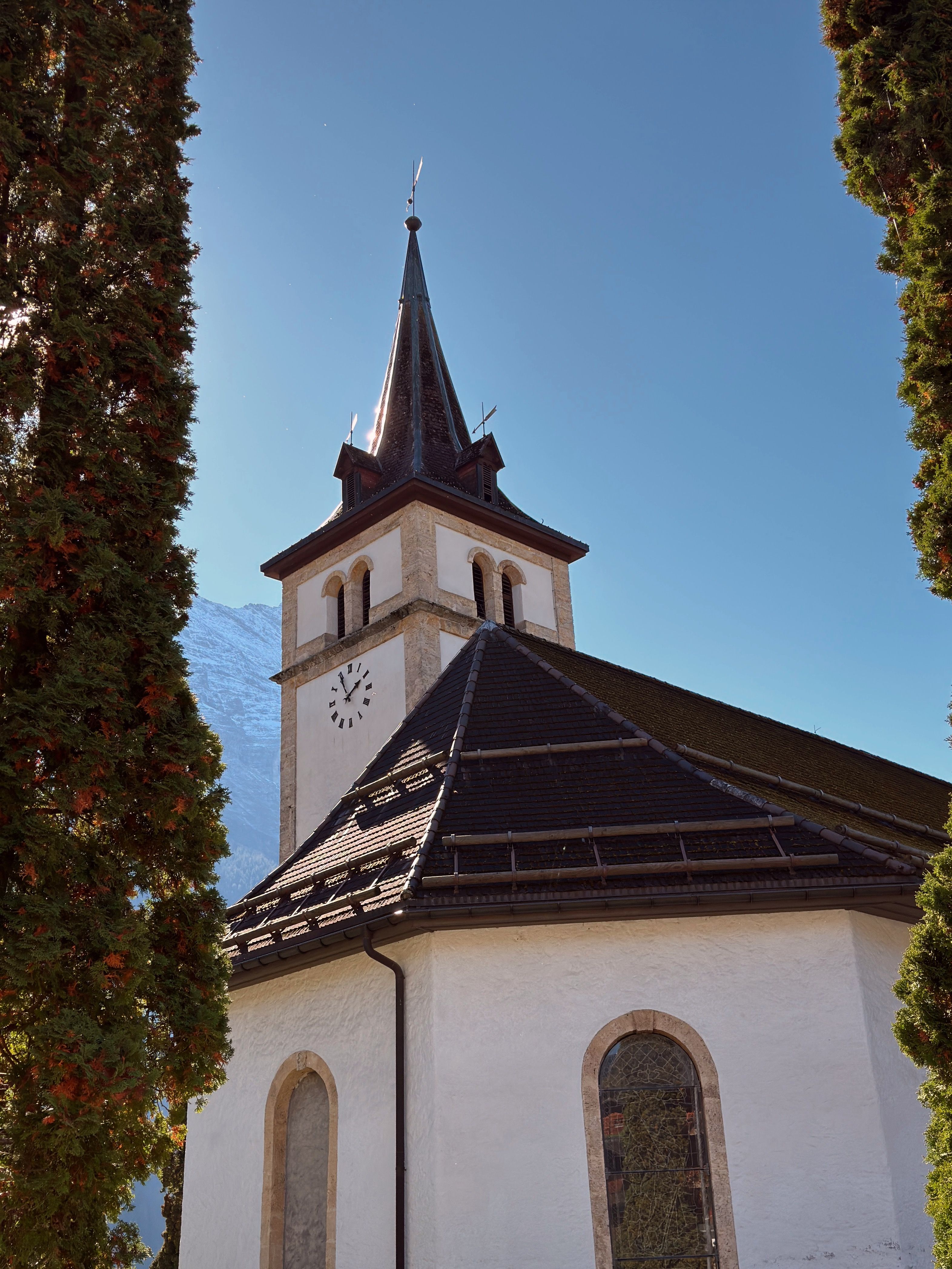 Historic Church Tower Under Clear Blue Sky · Free Stock Photo