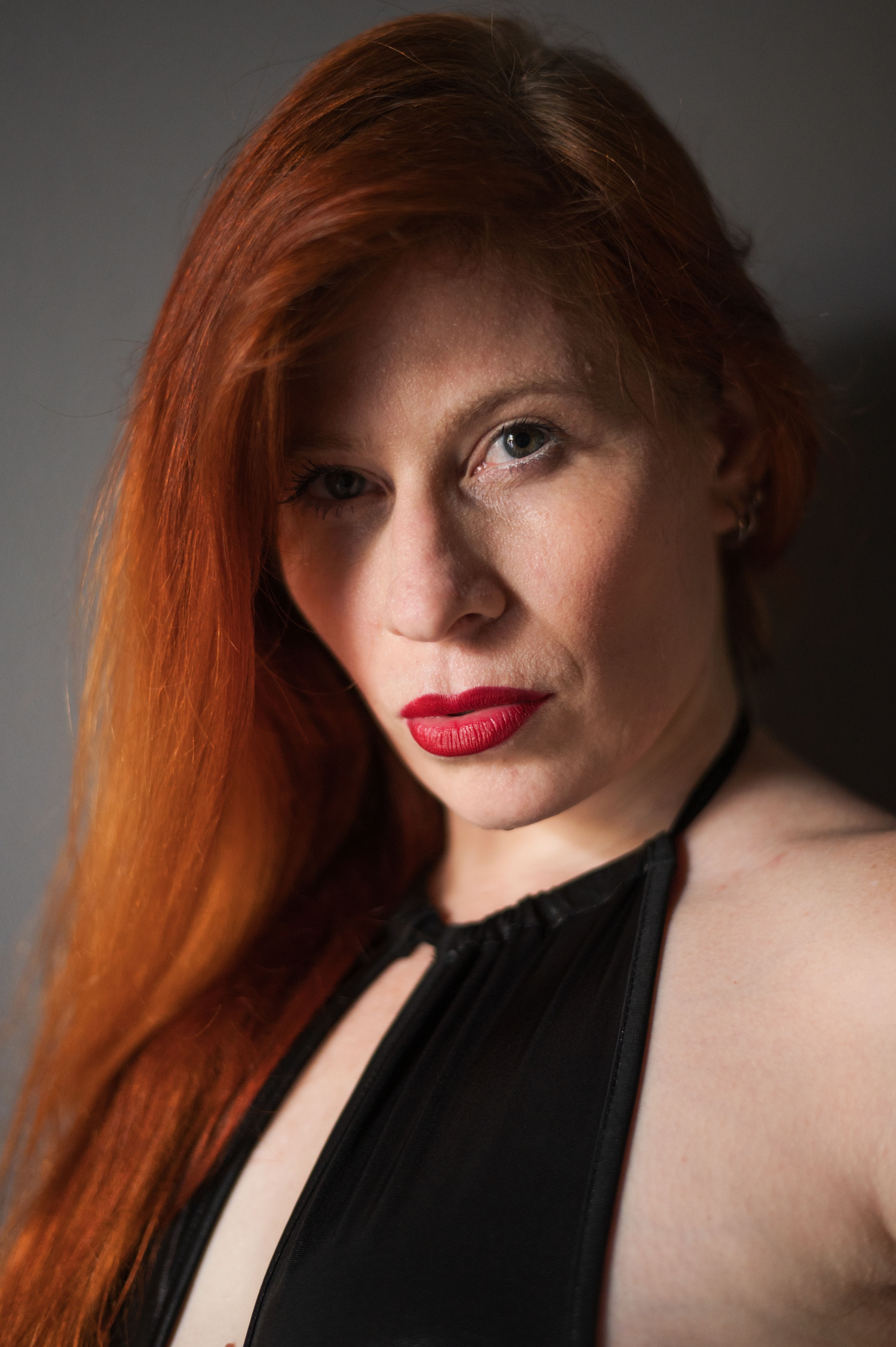 Close-Up Portrait of a Woman with Red Hair · Free Stock Photo
