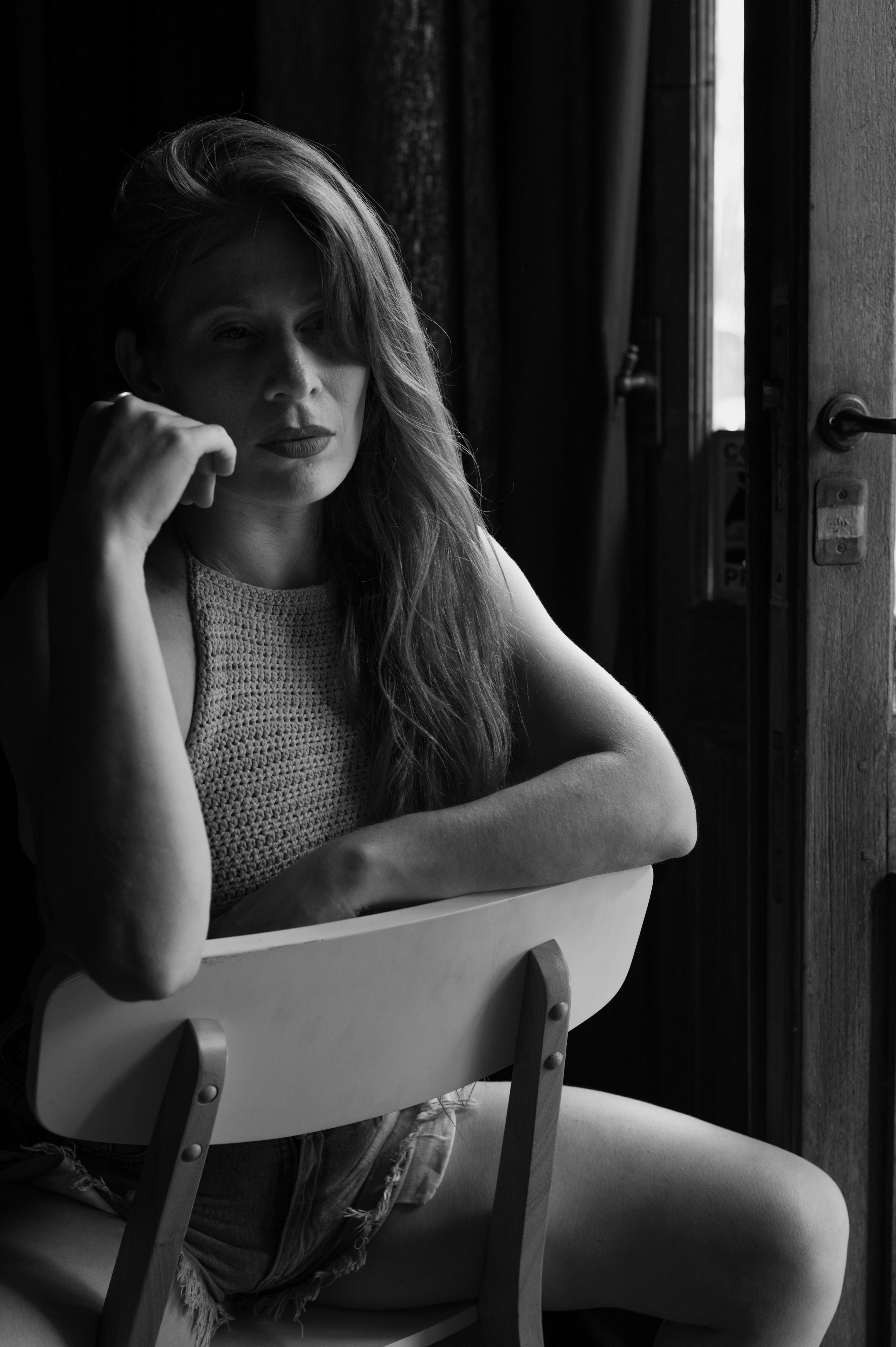 Black and White Portrait of a Woman by a Window · Free Stock Photo