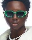 Stylish Portrait of Individual Wearing Green Sunglasses