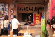 Chinese Street Food Vendor Preparing Noodles
