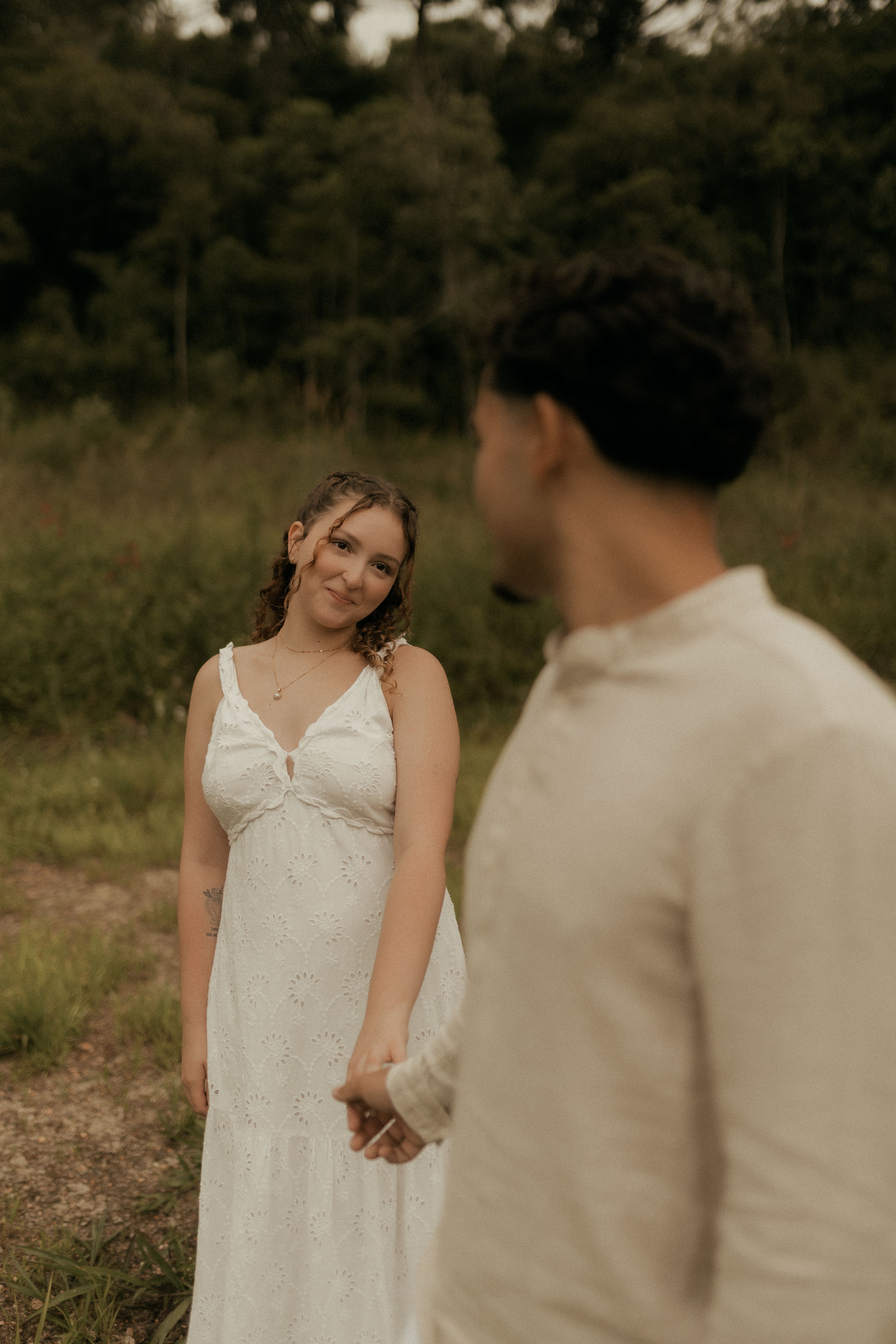 Romantic Couple in Nature Holding Hands · Free Stock Photo