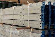 Stacked Metal Beams in Industrial Warehouse