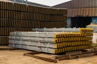 Industrial Metal Beams Stacked Outdoors