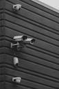 Black and White Security Cameras on Modern Building