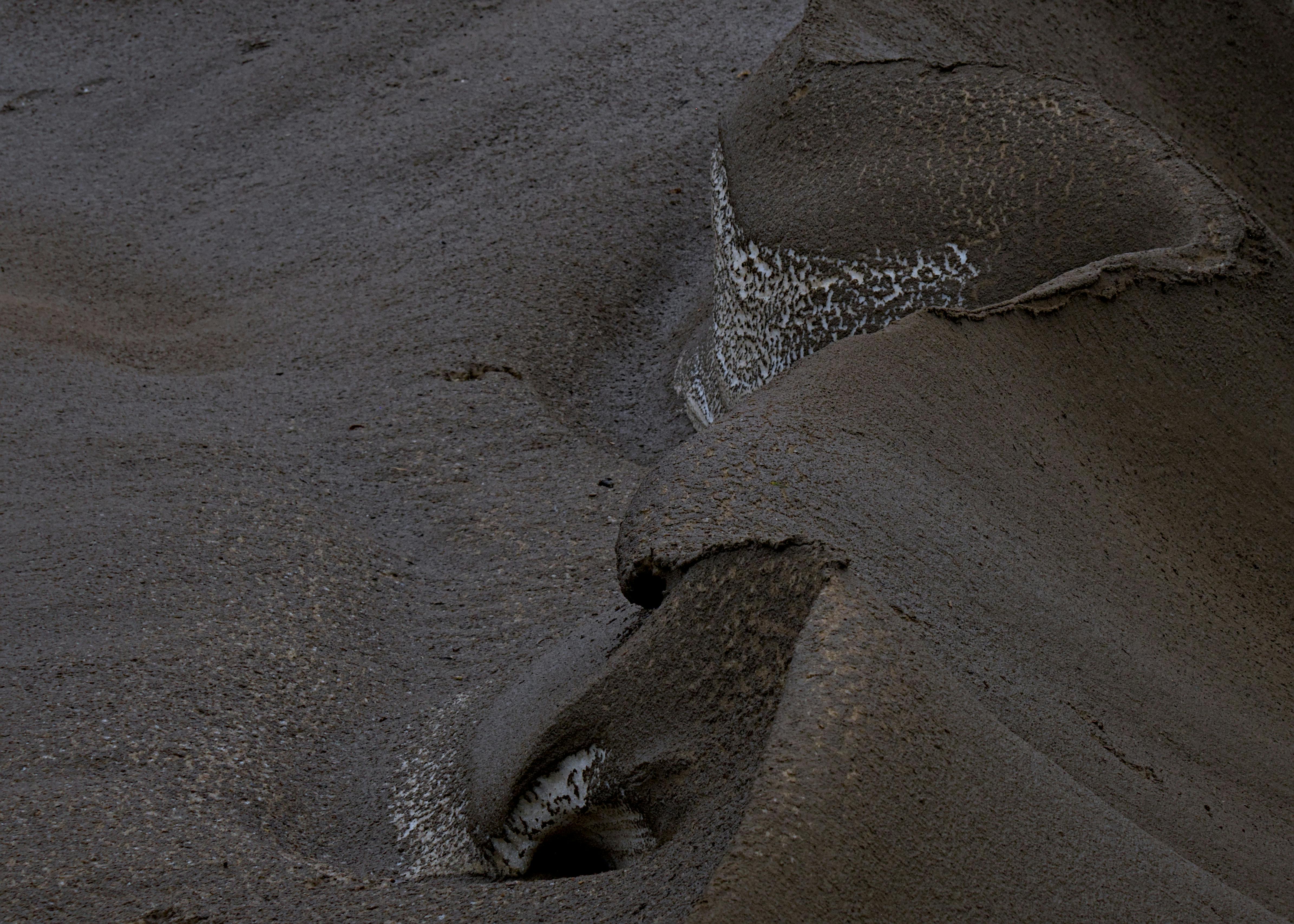 A textured landscape combining mud and snow during winter in Ontario, Canada.