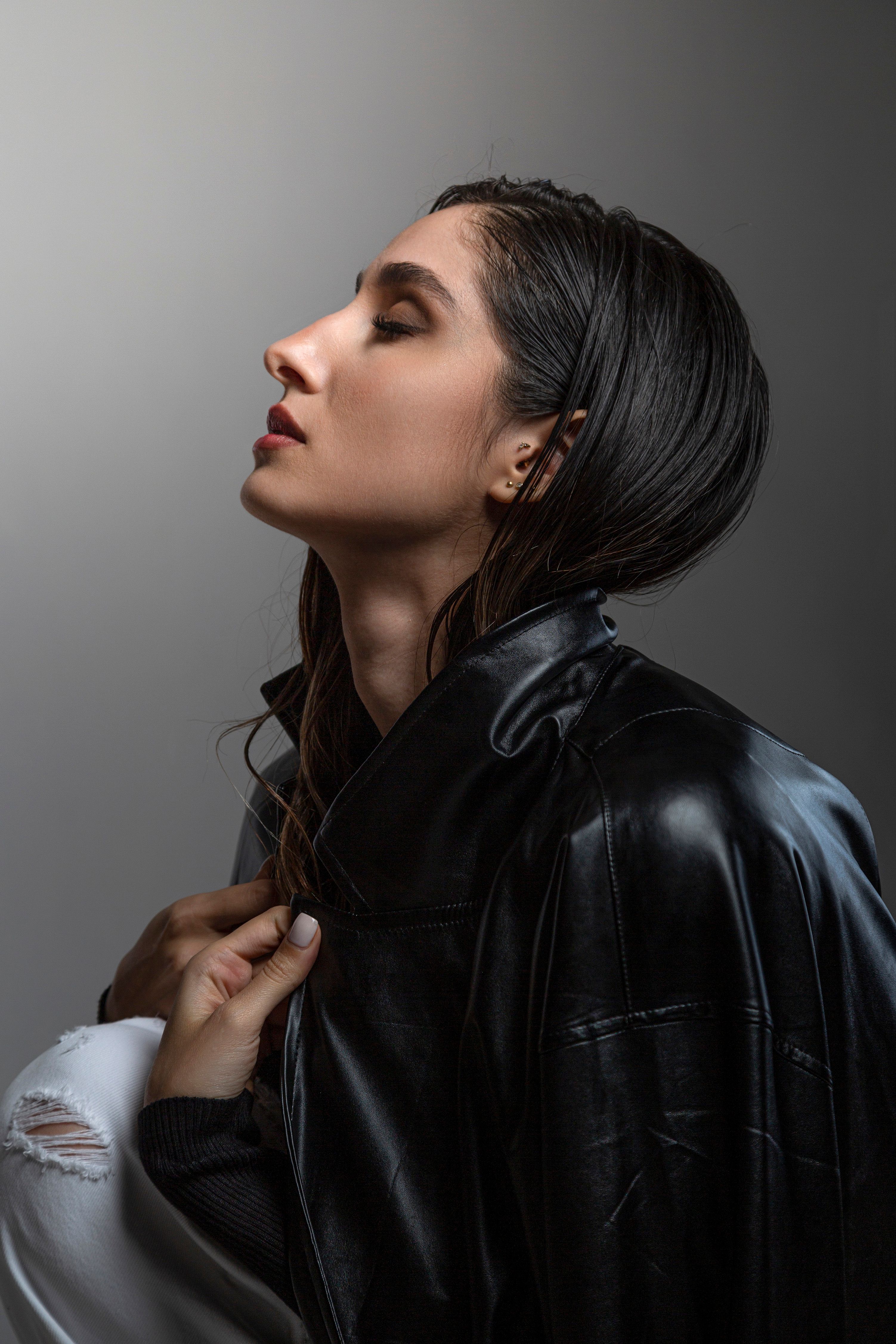 Elegant woman in black leather jacket