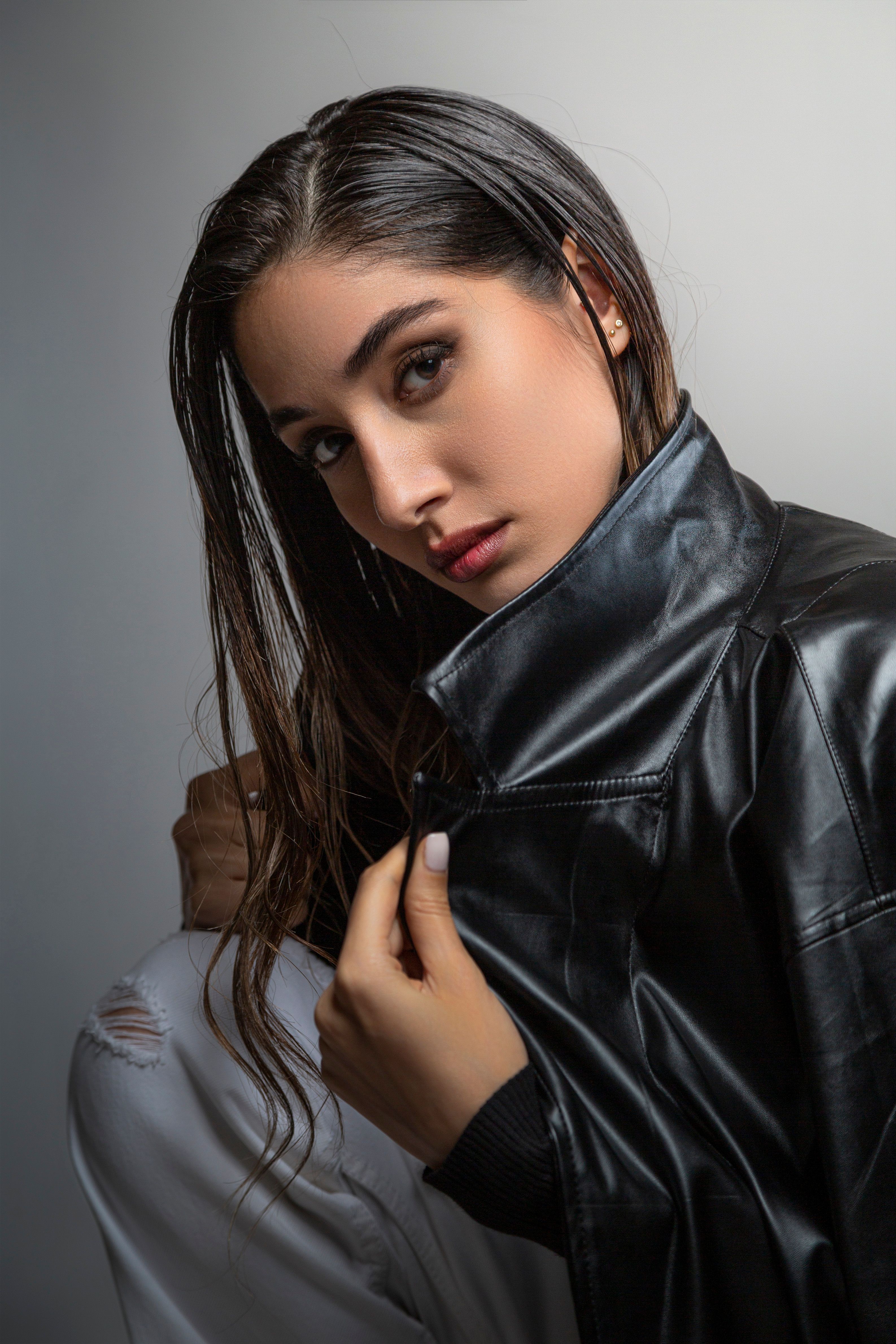 Confident woman in leather jacket