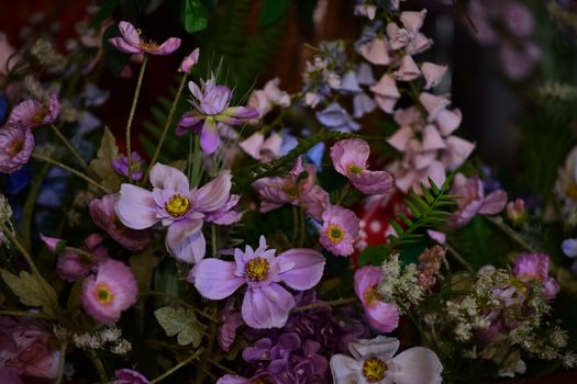 A vibrant spring bouquet featuring pink flowers and lush greenery, perfect for nature lovers.