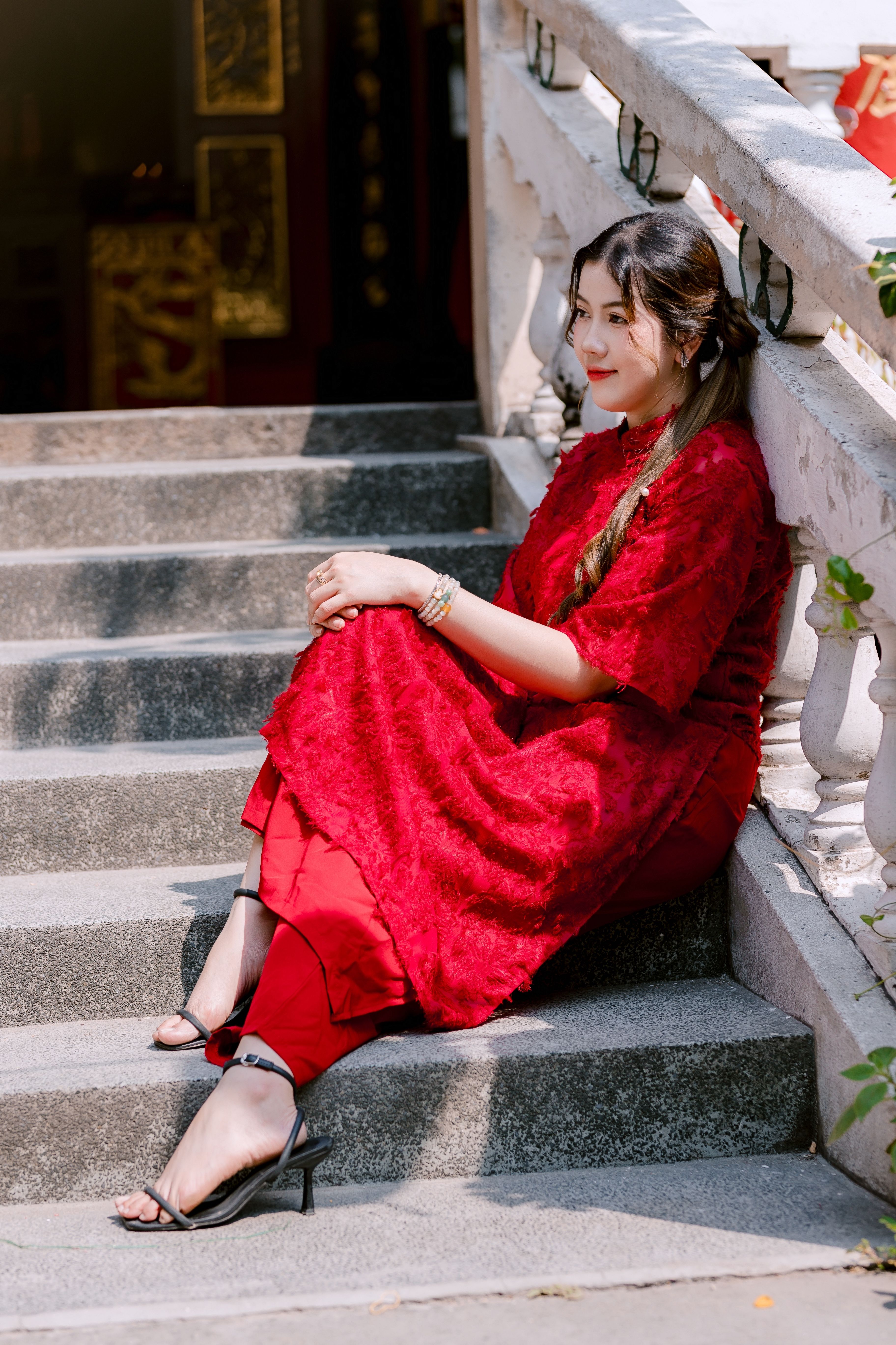 Elegant Woman in Red Dress Sitting on Steps · Free Stock Photo