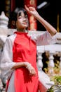 Young Woman in Traditional Asian Dress in Sunlight