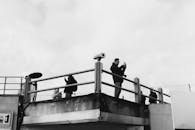 Black and White Photo of People on İstanbul Rooftop