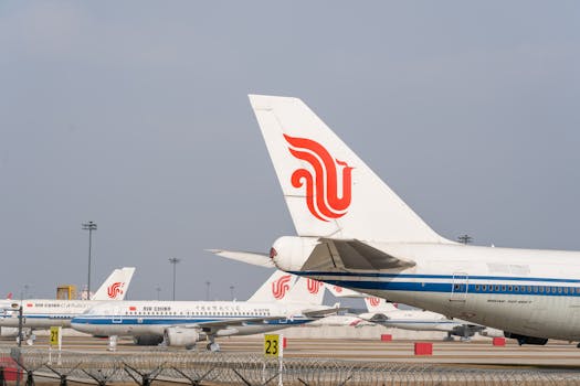 Multiple Air China aircraft lined up on an airport runway, clear sky backdrop.