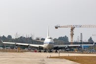 Large Airplane Parked at Construction Site
