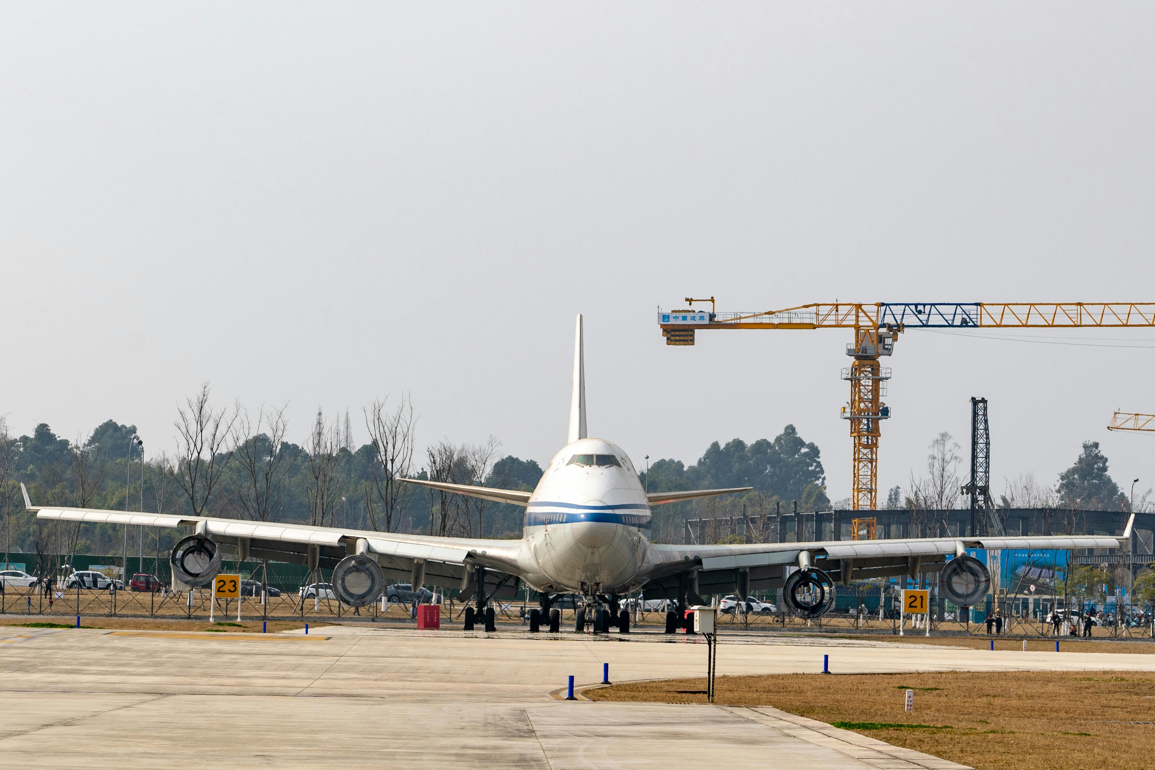 Large Airplane Parked at Construction Site