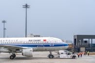 Air China Airplane Being Towed at Airport