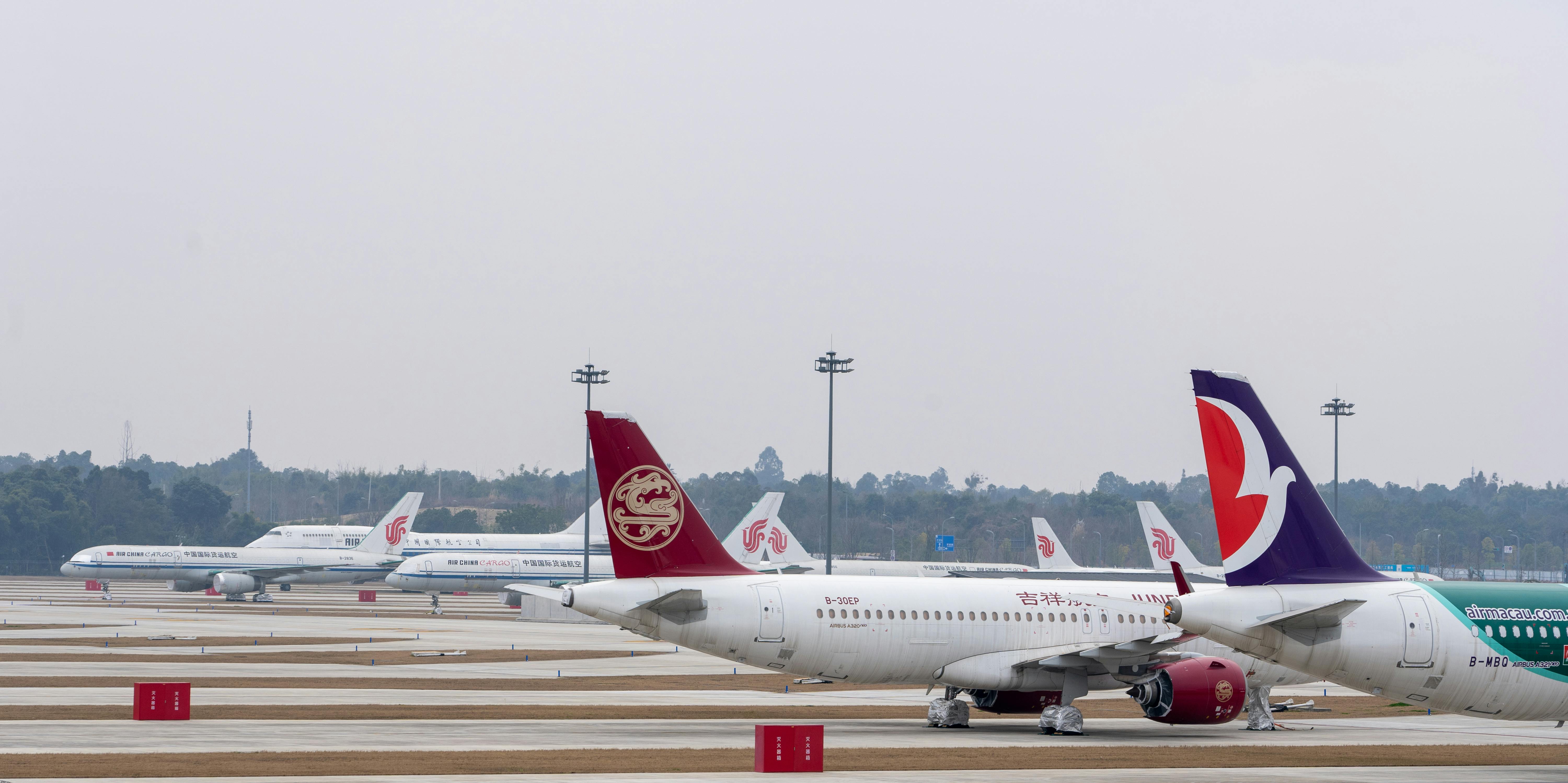 Airplane lineup at a busy airport terminal