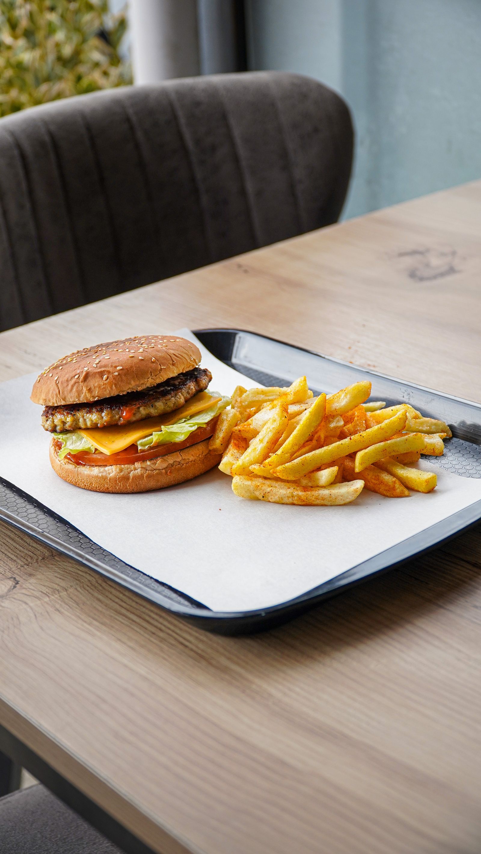 Plant-based burger with fries on a tray