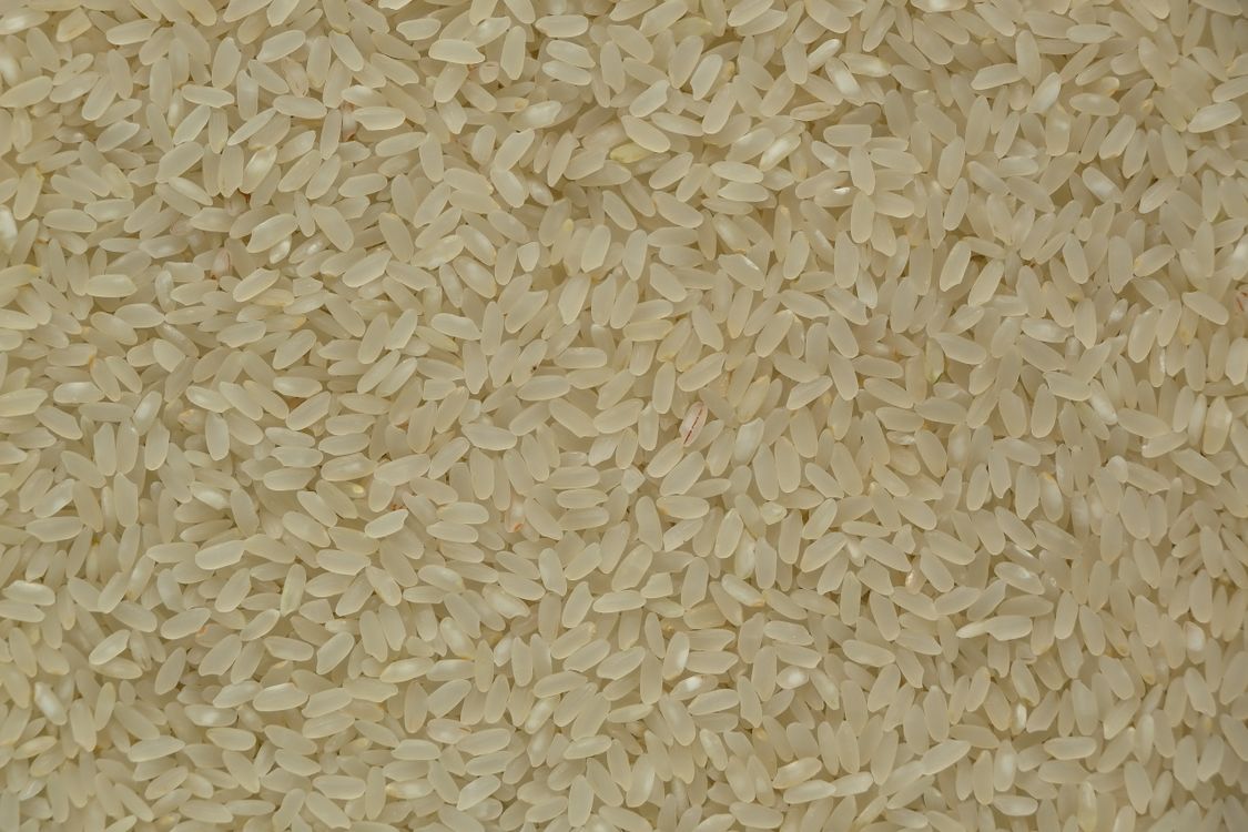 Uncooked Rice Texture Close-up of Uncooked White Rice Grains ยท Free Stock Photo