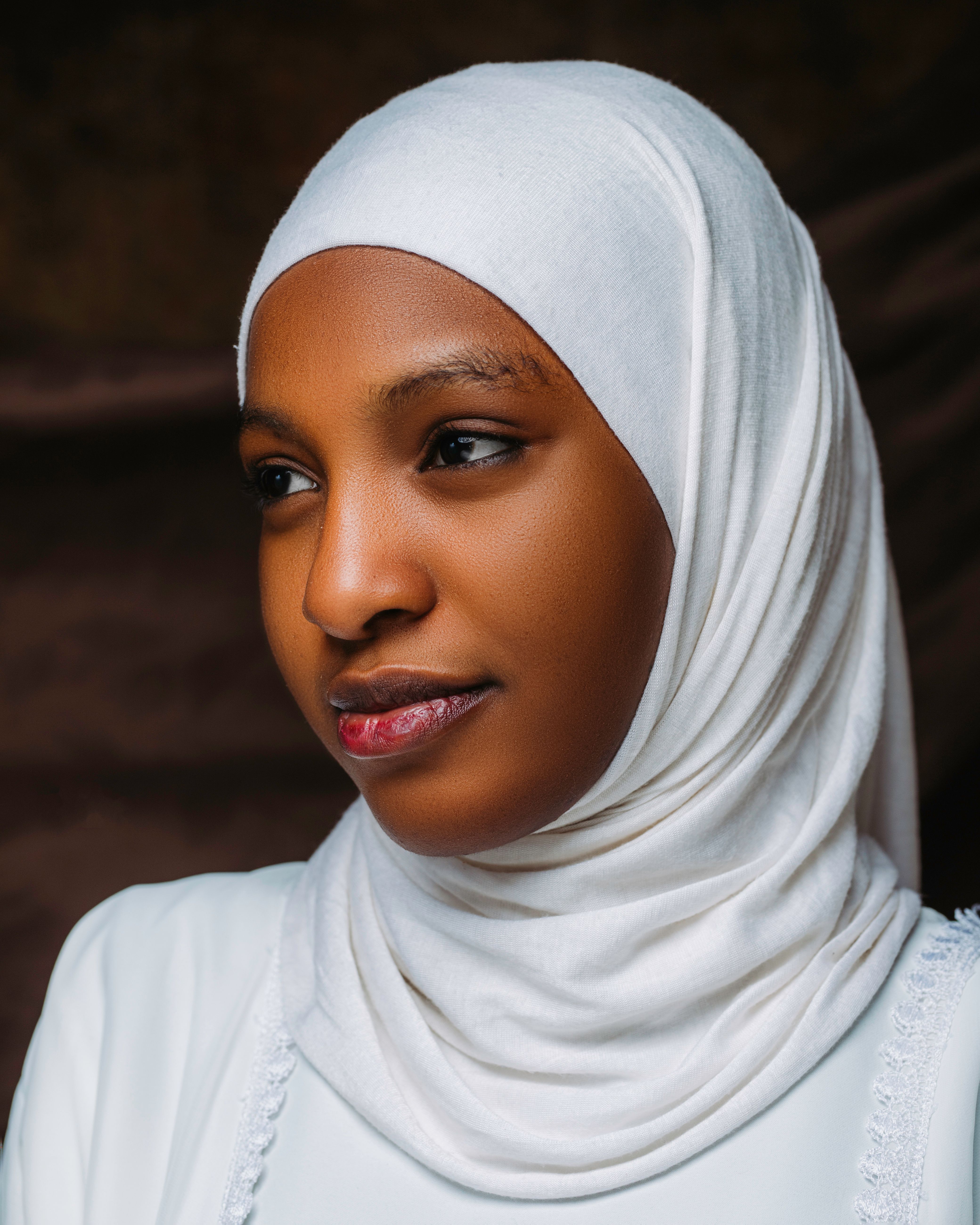 Portrait of a Woman in White Hijab with Thoughtful Expression · Free ...