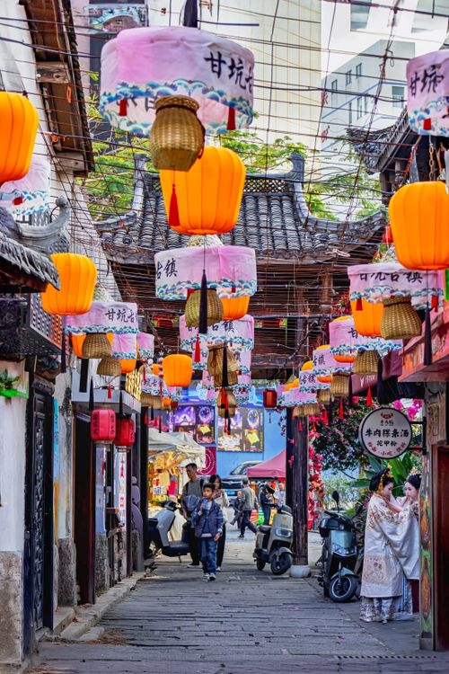 Free Colorful lanterns in a Chinese market street, capturing the vibrant cultural atmosphere. Stock Photo